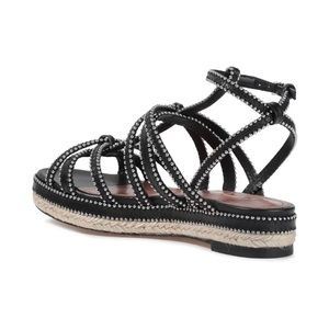 Alaia flat back sandals.